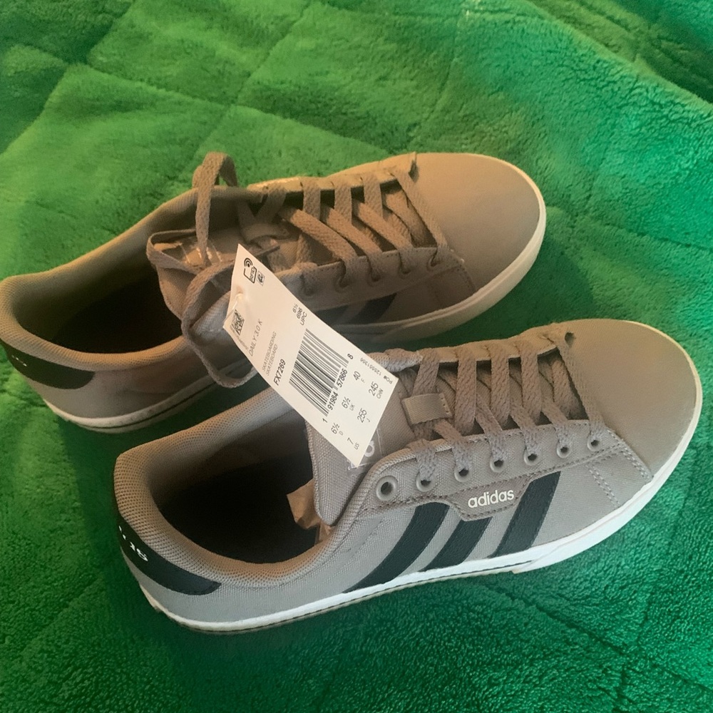 New with tags adidas sneakers. Grey with black accents.